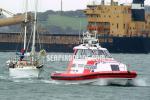 ID 1138 AUCKLAND COASTGUARD (LION FOUNDATION RESCUE) tows in a disabled yacht to Auckland, NZ.